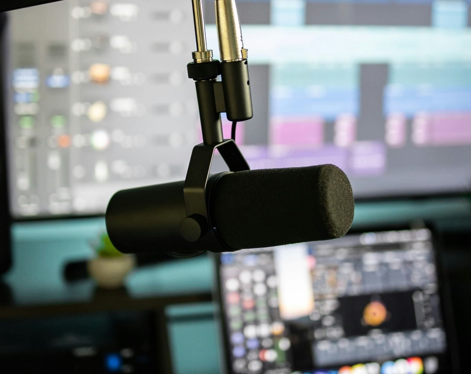 Microphone in front of computer screens