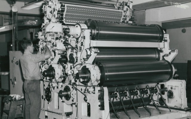 A commercial book printer running a print job